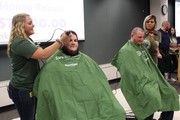 KACC Student Shaving hear of CSL Behring staff member for St. Baldrick's fundraiser